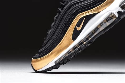 Black And Metallic Gold Cover This Nike Air Max 97 •
