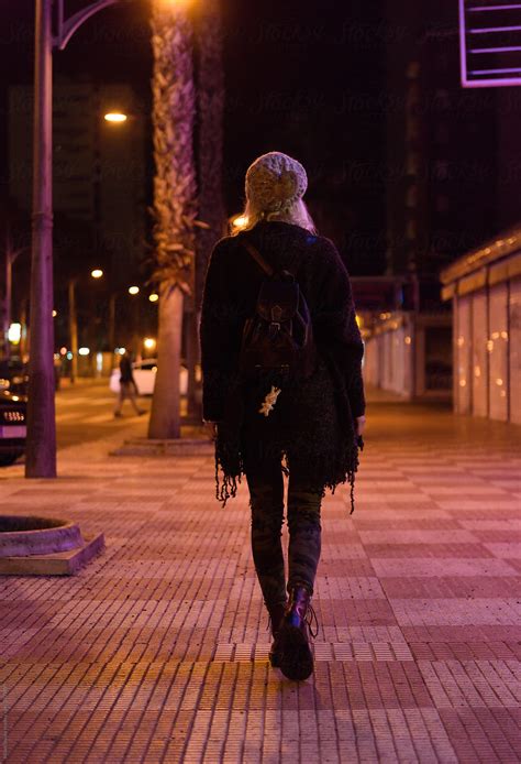 Woman Walking On Night Street By Stocksy Contributor Milles Studio