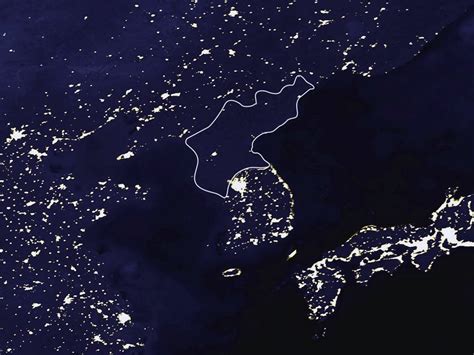 Photo about north korea from space on planet earth at night with visible country borders. Satellite map of North Korea at night | North Korea | Asia ...