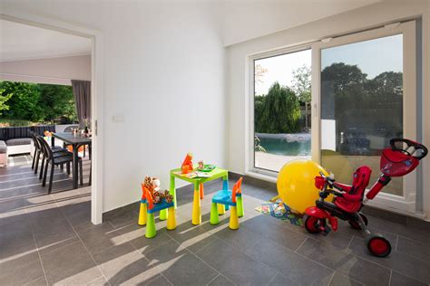 Designing a playroom usually comes down to a choice between style and comfort, and parents and children tend to have different opinions and priorities. Villa Franka Nedešćina in Istria, house near pool ...