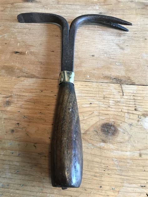 It also has a rose. ANTIQUE GARDEN TOOLS