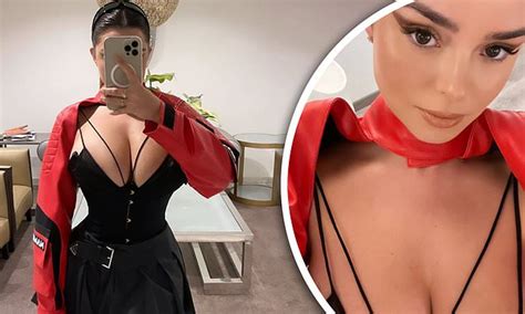 Demi Rose Puts On A Very Busty Display And Shows Off Her Tiny Waist In A Black Corset Mini Dress