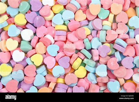 Background Of Brightly Colored Candy Hearts For Valentines Day Stock