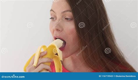 Woman Peeling A Banana And Eating White Background Stock Video Video Of Diet Beauty 116719943