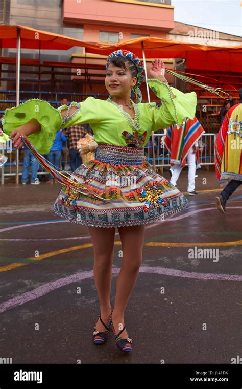 Traditional Bolivian Dancer In Colourful Costume Parading Through The