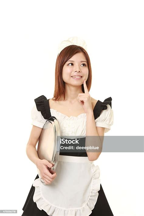 Young Japanese Woman Posing In French Maid Costume Stock Photo