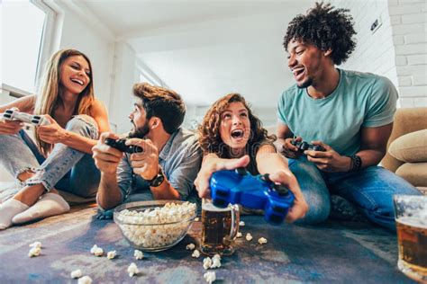 Group Of Friends Play Video Games Together At Home Stock Image Image Of Button Play 132637487
