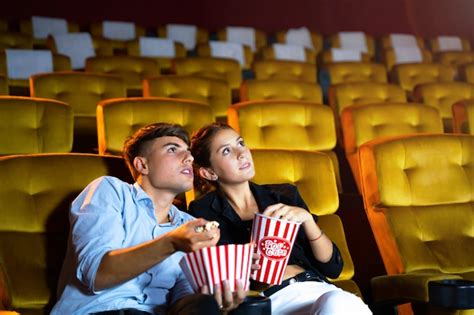 Premium Photo Young Couple People Watching Movie At Movie Theater