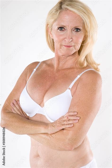 Portrait Of Semi Nude Mature Woman With Arms Crossed Stock Photo Adobe Stock