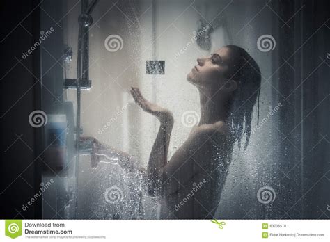 Unfocused Portrait Of A Woman Showering Through The Bath Screen With Little Dropsrelief And