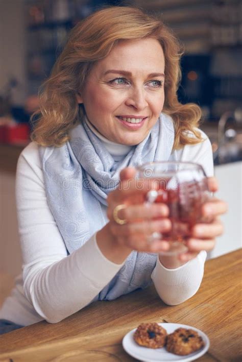 smiling mature woman enjoying a cup of tea stock image image of side beverage 102880905