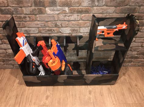 The gun holders are acoustic foam tiles, cut to fit and the shelves are lined with thick, tool box drawer liners (to prevent the guns from. Ideas To Build A Nerf Gun Rack - 4 Ways To Modify A Nerf ...