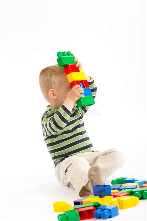 Little Cute Boy Playing With Building Blocks Isolated On White Stock