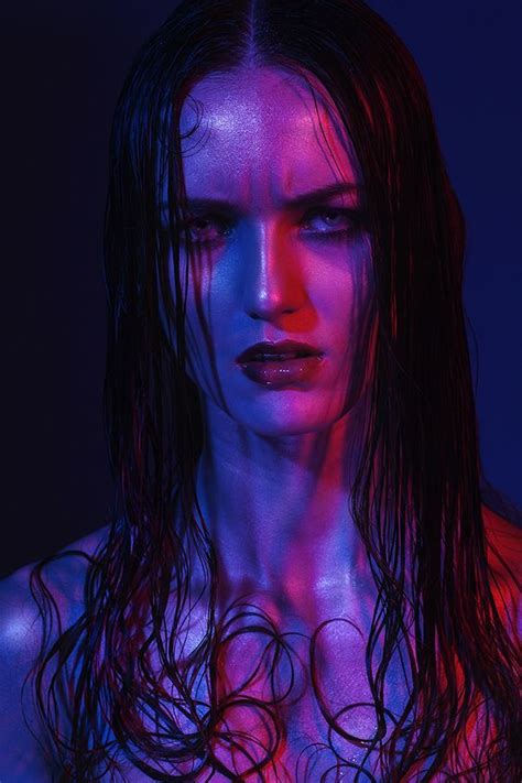 A Woman With Wet Hair And Blue Light
