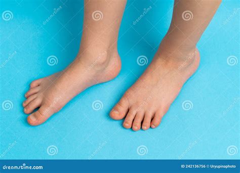 Childrenand X27s Feet On A Blue Background Front View The Concept Of