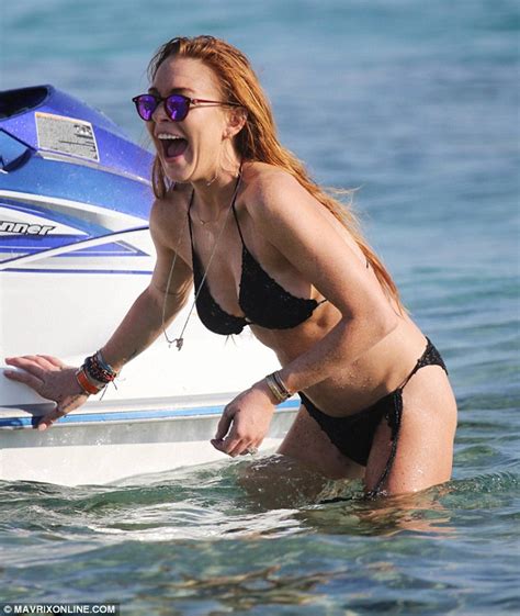 Lindsay Lohan Puts On Another Side Show In Black String Bikini In