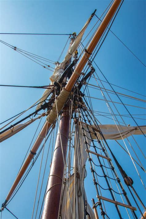 The Mast Of An Antique Sailing Ship With Sails And Rigging Stock Photo