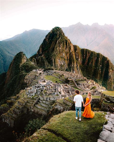 | shrouded by mist and surrounded by lush vegetation and steep escarpments, the sprawling inca citadel of machu picchu. MACHU PICCHU - 2019 Complete Guide to Visit Machu Picchu, Peru