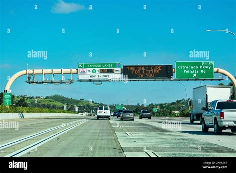 Express Lanes Marked By Large Overhead Signage With Toll Amount The