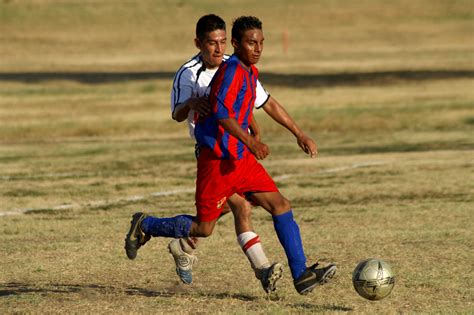 [Men playing soccer] - The Portal to Texas History