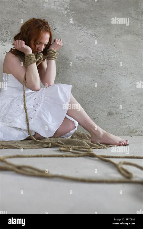 Young Girl Tied Up On The Floor The Abducted Girl The Victim O Stock