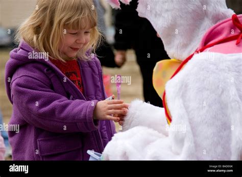 Young Girl Getting Toy From Easter Bunny Stock Photo Alamy