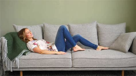 Woman Laying Down On Couch By Thestockcompany Videohive
