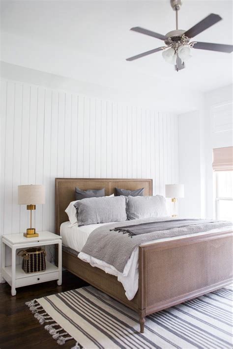 We recommend using our retreat 8 platform with this bed. White Paneling on the walls, RH Cane Bed, linen RH bedding ...