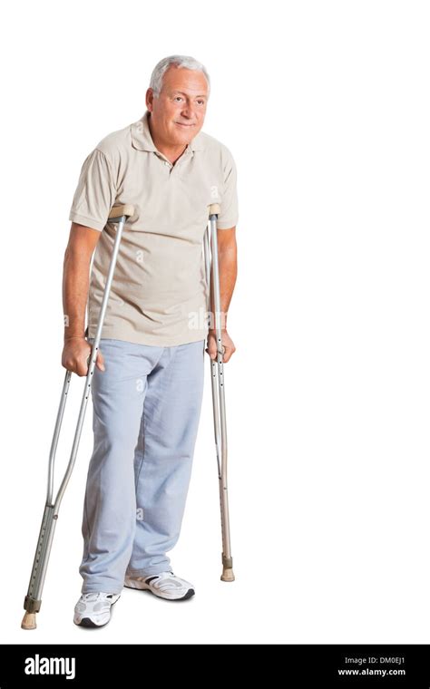 Senior Man On Crutches Looking Away Stock Photo Alamy