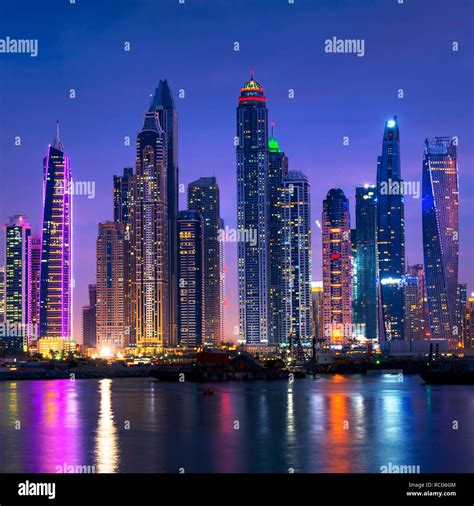 Dubai Marina Skyline At Night With Water Reflections United Arab
