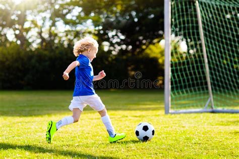 Kids Play Football Child At Soccer Field Stock Photo Image Of