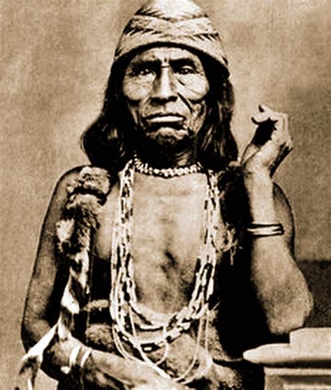 An Old Black And White Photo Of A Native American Man