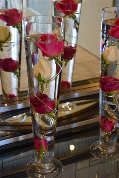 Now that you've got your vegan baking down pat, add rose petals to your cake and dessert decorations. Flower displays in water | Wedding floral centerpieces ...
