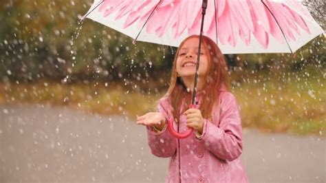 Cheerful Girl With Umbrella Under Rain Stock Footage Videohive