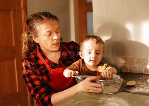 mother and son in kitchen cooking together at home stock image image of kitchen blurring