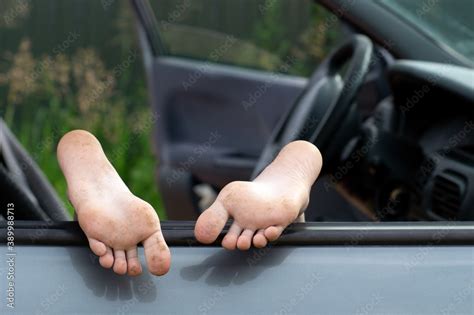 Schoolgirls Bare Feet Sticking Out Car Window Outdoors ภาพถ่ายสต็อก