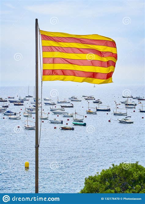 Flag Of Catalonia Called Senyera Isolated Over A Maritime Background