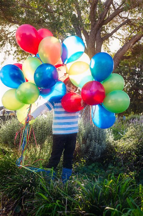 Boy With A Large Bunch Of Brightly Coloured Balloons Del Colaborador