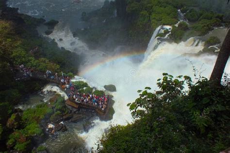 Beautiful Scenery Of Rainbow At Iguacu Iguazu Falls Bridge With People