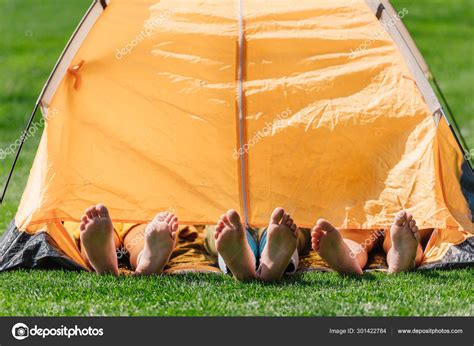 Cropped View Kids Barefoot Lying Yellow Camp — Stock Photo © Haydmitriy