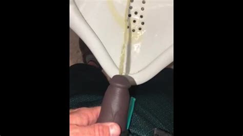 Using A Hollow Cock Sleeve Packer Device To Go Pee Into A Urinal For The First Time Xxx Mobile