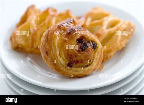 Small Danish Pastries On Stack Of White Plates Stock Photo Alamy