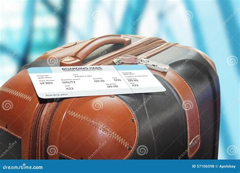 Suitcase And Boarding Pass In The Airport Stock Photography