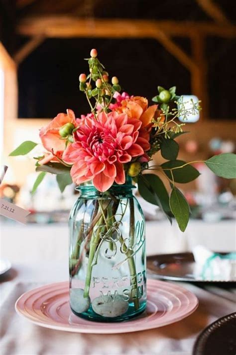 Mason Jars Filled In With Colourful Flowers As Wedding