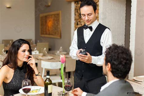 Waiter Taking Orders In A Restaurant Stock Photo Crushpixel