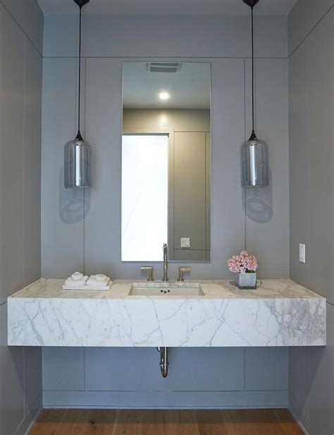 This shell shaped marble sink origins from italy, circa 1780. Floating Marble Sink Vanity with Gray Glass Pendants - Contemporary - Bathroom