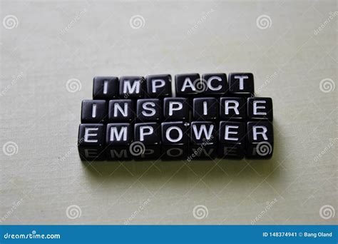 Impact Inspire Empower On Wooden Blocks Business And Inspiration
