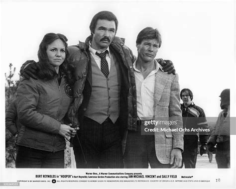 Burt Reynolds Has His Arms Around Sally Field And Jan Michael Vincent