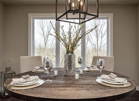 This means that the chandelier's height is important not only for its function as a light fixture but also for its role in the overall room decor. How High to Hang A Chandelier Over a Dining Table