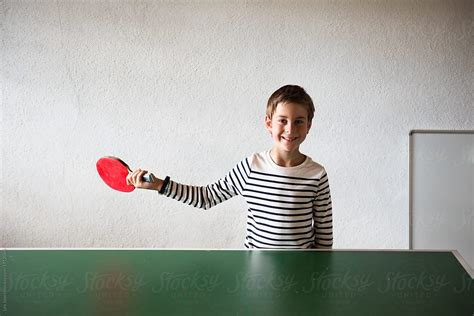 Little Boy Playing Ping Pong Table Tennis By Stocksy Contributor